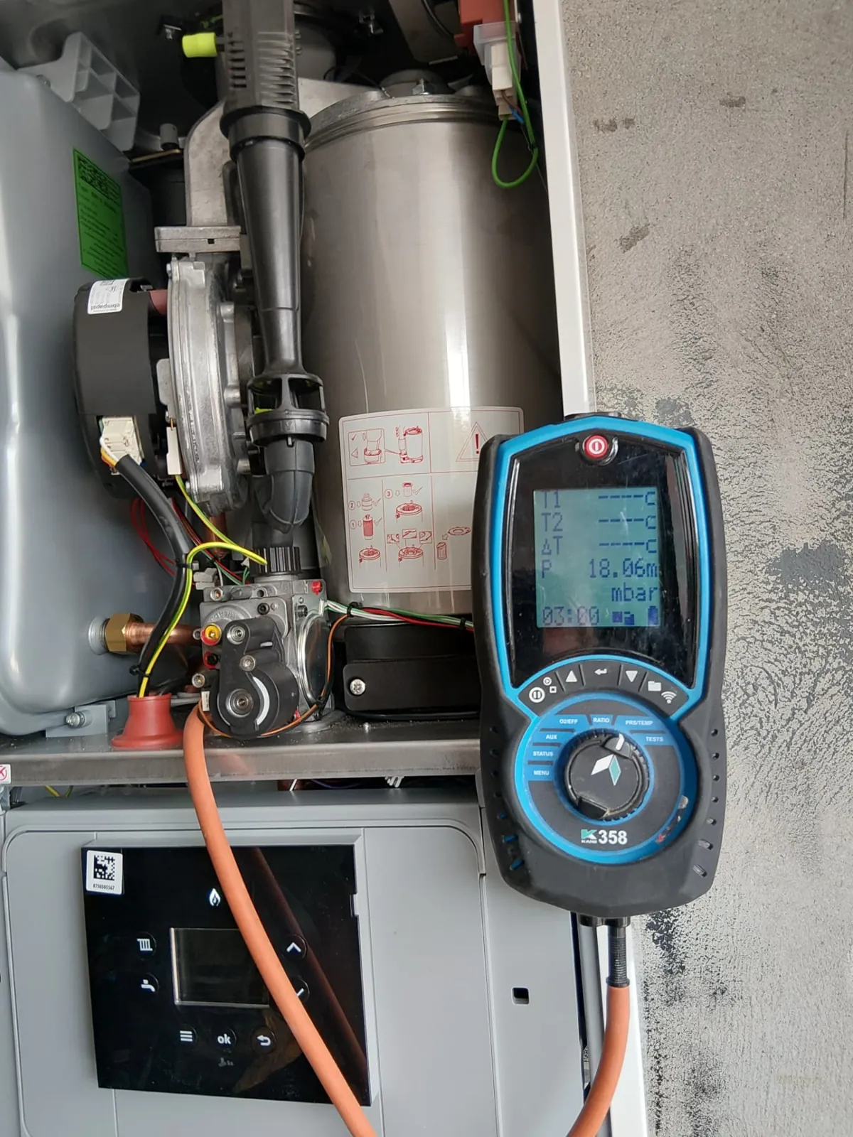 Boiler internals open with a Kane analyser in the foreground