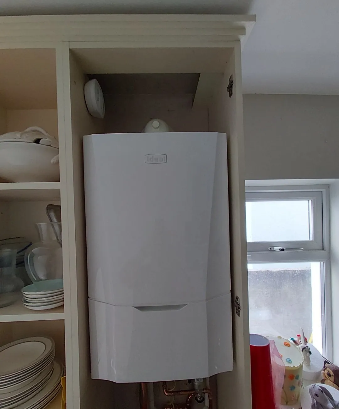 Ideal combi boiler fitted into a kitchen press after a conversion